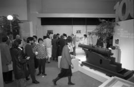 People looking at Legacies Program exhibit at The Bay