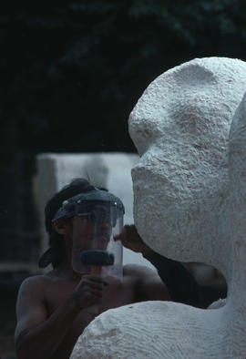 David Ruben [Piqtoukin] working on sculpture