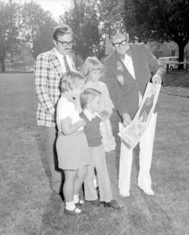 [Jim Johnstone from Elks Lodge No. 1 displays a poster for a preview of the] Canadian Internation...