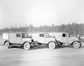 Three American News Company trucks