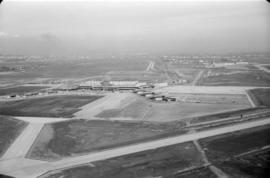 Aerial view of airport terminal, runways and approaches to Sea Island