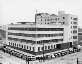 [Vancouver Police officers and vehicles assembled in front of Public Safety Building]