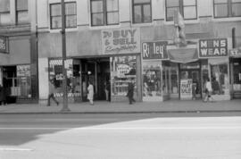 [54-60 East Hastings Street - St. James Barber Co., The Option Shop and Ripley's]