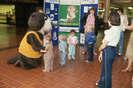 Tillicum interacting with children at Lougheed Mall