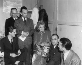 The Vancouver press interviewing Miss Anna Neagle and Director Herbert Wilcox, back stage at the ...