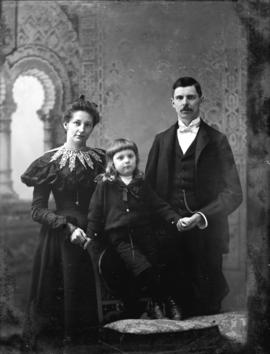 [Studio portrait of man, woman and girl]