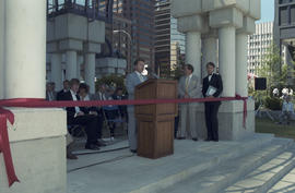 Unidentified man speaking at Portal Park opening