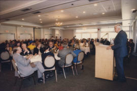 Patrick Reid addressing room of attendees