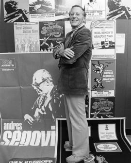 Hugh Pickett with event posters