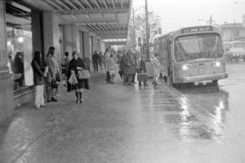 Bus stop at Hudson's Bay Company building, W. Georgia Street