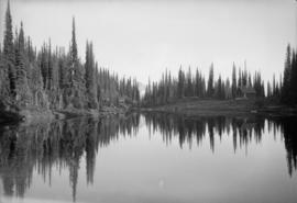 View of a cabin across a lake