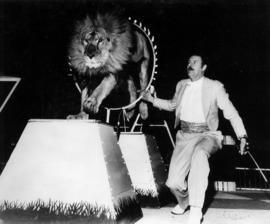 Prince El Kigordo's Trained Lions : [publicity photo of trainer and lion in circus performance]