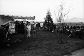 Site of sign unveiling with sign under tarp