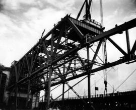 [Dominion Bridge crane in construction of Granville Street bridge and spectators.]