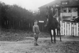 Woman on horse named Midnight and her brother, Frank Jr.