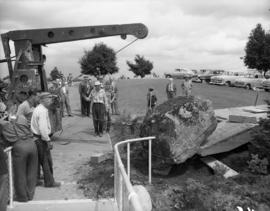 Moving Centuries Rock onto site containing time capsule, Queen Elizabeth Park