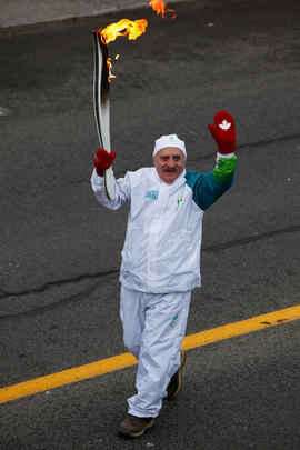 Day 36 Torchbearer 66 Andre Montambault is carrying the flame in Charny, Quebec