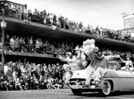 [Clowns on the hood of a car in the Grey Cup Parade]