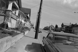 [View of street with vehicles]