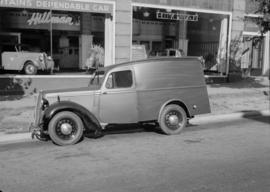 Automobile parked in front of Hillman Car Sales