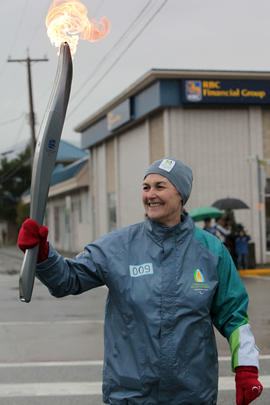 Torchbearer 9 Kate Foster carries the flame in Squamish, BC