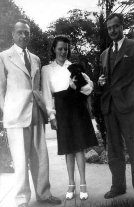Ted, Mary, Ken Taylor [standing outside]