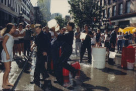 "Giant Fire Drill" participant carrying bucket of water