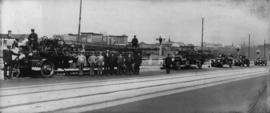 [Firefighters and civic officials on Georgia Viaduct with new fire fighting equipment]