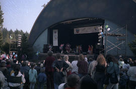 Crowd watching First Nations dance performance on Chevron Stage