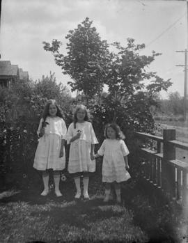 Phyllis, Muriel and Audrey standing in yard