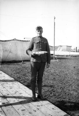 J.C. [James Crookall] outside Mess tent, Leaside