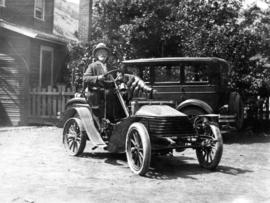 [Richard Trodden at the wheel of a "Wolseley" car]