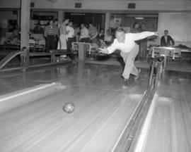 [Bowler in action]