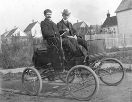 [Alexander Fenton and Percy H. Burnet in the Fenton's "locomobile"]