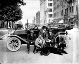 [Group portrait of hunters with a black bear on Georgia near Seymour Street]