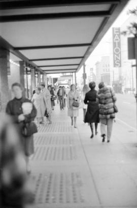 Sidewalk under Birks Building awning, southwest down Granville Street