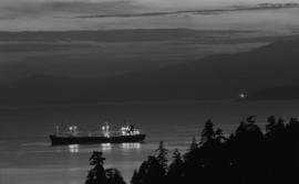 Night anchorage [ship in harbour at night]