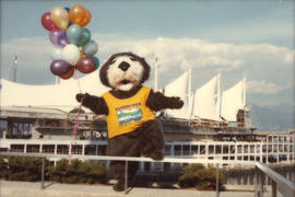 Tillicum holding balloons in front of Canada Place