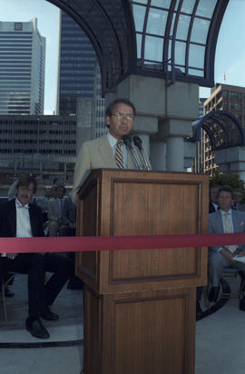 Unidentified man speaking at Portal Park opening