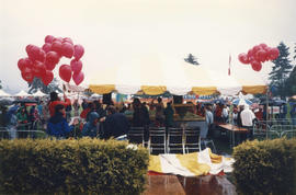 Festival attendees standing around the Canada Day birthday cake