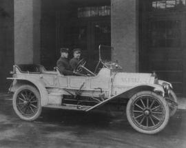 [Chief J.H. Carlisle and driver seated in Fire Department automobile]