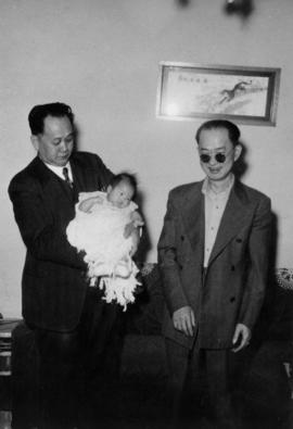 Foon Wong with baby and unidentified man