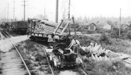 [Derailed B.C.E.R. car and spilled railway ties]