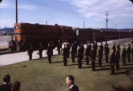 Marching band playing in front of Pacific Great Eastern train