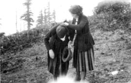 In Mount Rainier Park : getting it out [removing the snow from Myrtle Kilpatrick's neck]