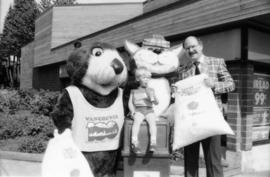 Tillicum, Mike Harcourt, MacTavish and child holding plastic bags