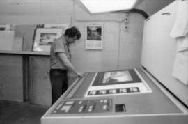 Unidentified man examines Toni Onley Centennial Art Series print at Agency Press