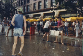 "Giant Fire Drill" participants pass buckets of water