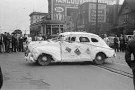 [Car decorated with flags in Chinese parade during VJ Day celebrations]