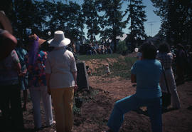Distant view of seated sculptors on opening day